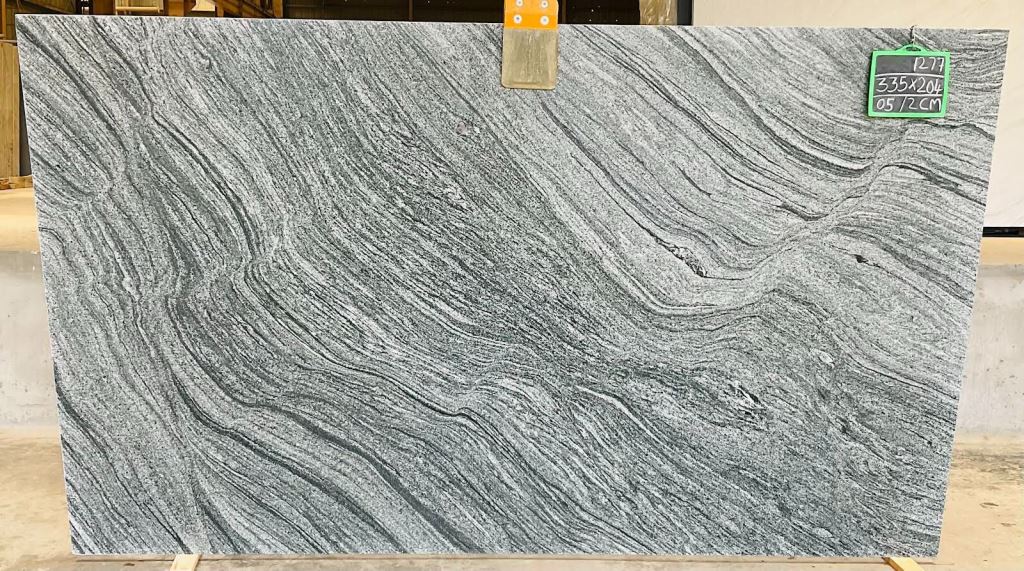 Grey Mist granite slab — flowing grey with silver wave banding