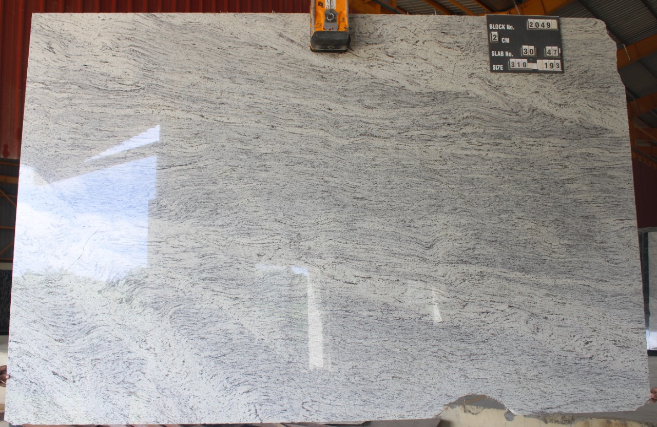 Ivory White granite slab — white with grey silver waves